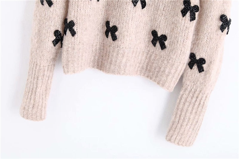 SWEATER WITH BOWS