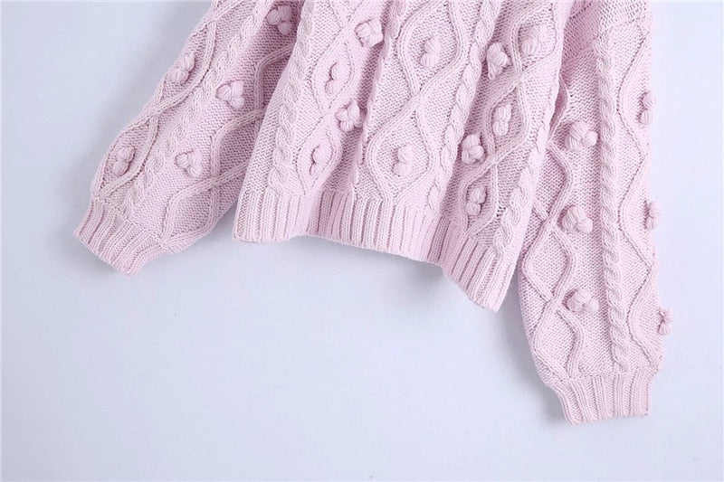 KNIT SWEATER WITH POMPOMS